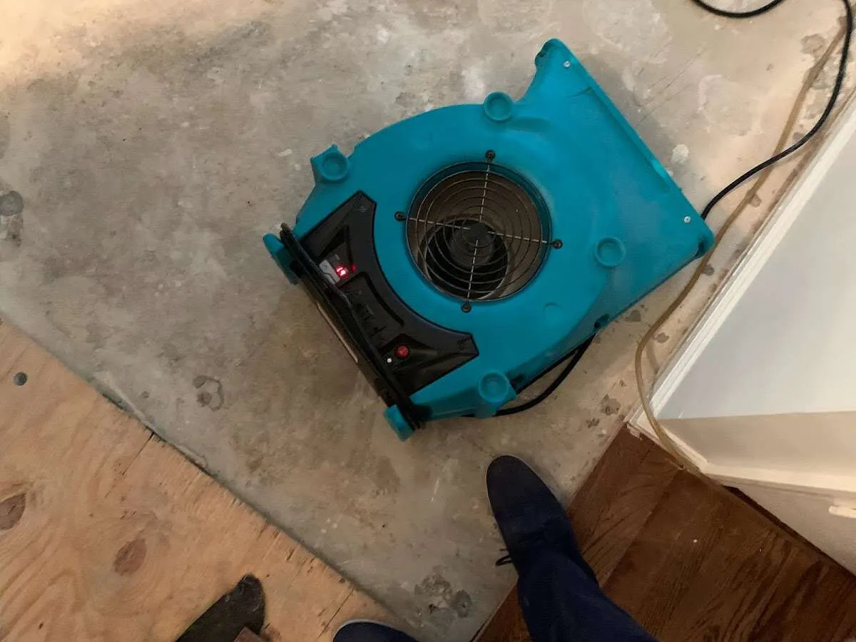 Air mover drying subfloor during Commercial Water Damage Restoration in Lucerne Valley